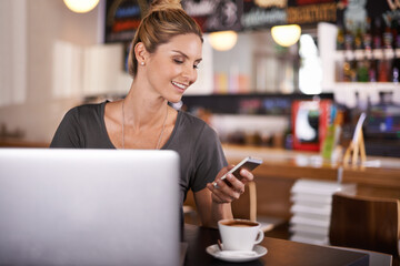Woman, reading and phone on social media in cafe and writer with remote work in restaurant. Happy, person and scroll smartphone with news, article or review coffee shop on blog, website or laptop