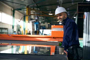 Man at a workplace in window production