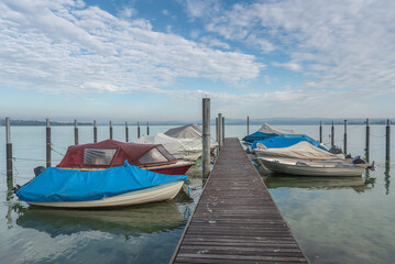 Naklejka na ściany i meble Boats moored at jetty on Lake Constance, Berlingen, Canton of Thurgau, Switzerland