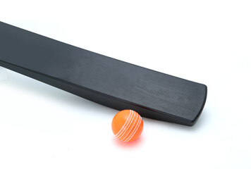 wind ball with black pvc cricket bat isolated 