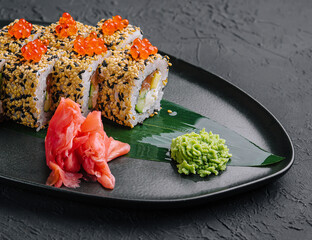Sushi roll sprinkled with sesame seeds