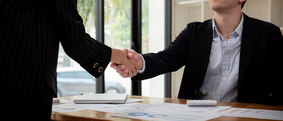 Meeting and greeting concept, Two business handshake and business people after discussing good deal of Trading contract and new projects, success, partnership
