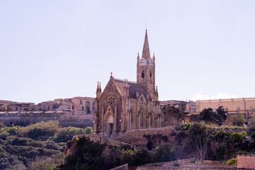 Fototapeta na wymiar Church of Holy Mother Lurdskayain Mgarr on the small island of Gozo - Malta 