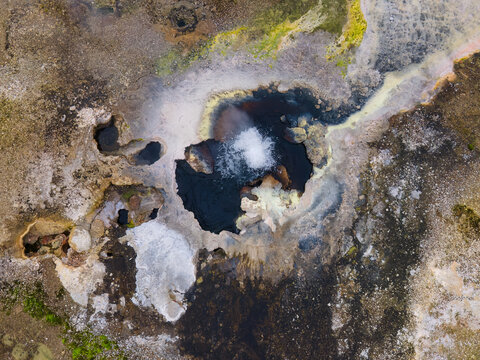 Aerial view of a bubbling geothermal hop spring in Hveravellir Nature reserve in Icelandic Highland