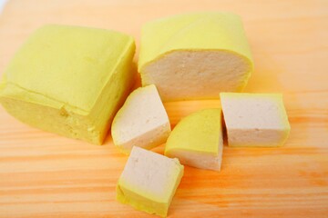 Takwa tofu or also called yellow tofu because turmeric is added to the soaking water. It has a...