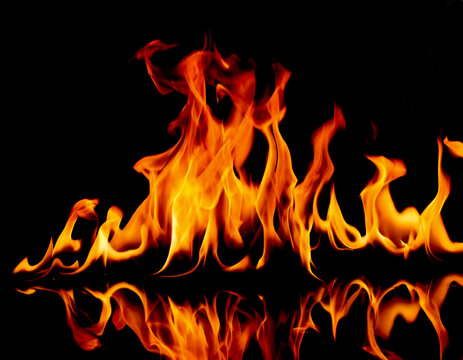 Fire flames on black background with reflexion