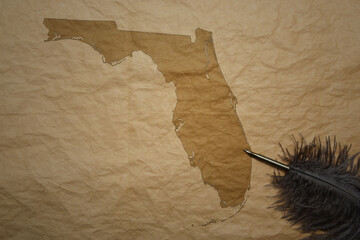 map of florida state on a old paper background with old pen
