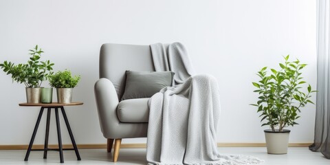 Minimal home interior design ideas featuring a vintage gray armchair with a white pillow and blanket