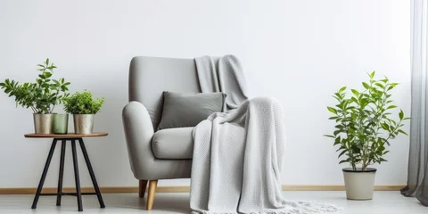 Fotobehang Minimal home interior design ideas featuring a vintage gray armchair with a white pillow and blanket © Vusal