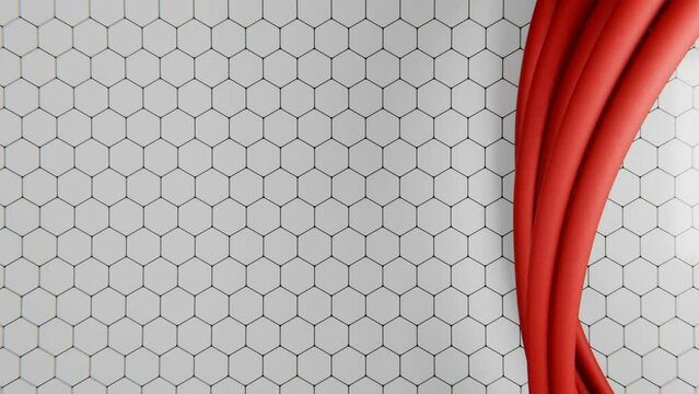 Bunch of red cables twisting over hexagon pattern. Seamless loop background, 4K video. A vibrant red fabric cable braid elegantly sweeps across a background of a white hexagonal pattern, creating a