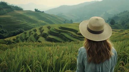 Foto op Canvas European girl among rice terraces and green plantations in Asia © brillianata