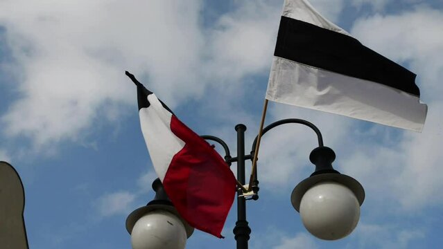 Black-and-white flag from lamppost