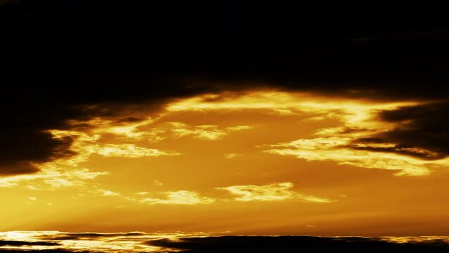 Time lapse Beautiful big sunrise orange Sunset Puffy fluffy dark cloud large yellow sun 4K video