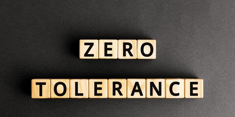Word ZERO TOLERANCE made with wood building blocks