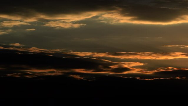 Time lapse Beautiful big sunrise orange Sunset Puffy fluffy dark cloud large yellow sun 4K video