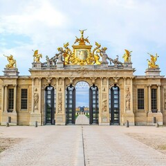 Fototapeta na wymiar The golden gate of the Palace of Versailles, or Chateau de Versailles, or simply Versailles, in France