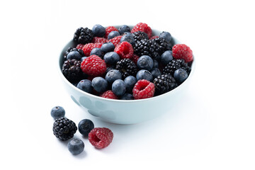 Fresh assortment berries in bowl isolated on white background