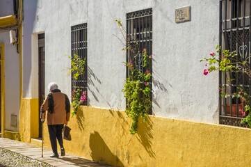 Grandma walking in the street in Cordoba in Andalusia, Spain