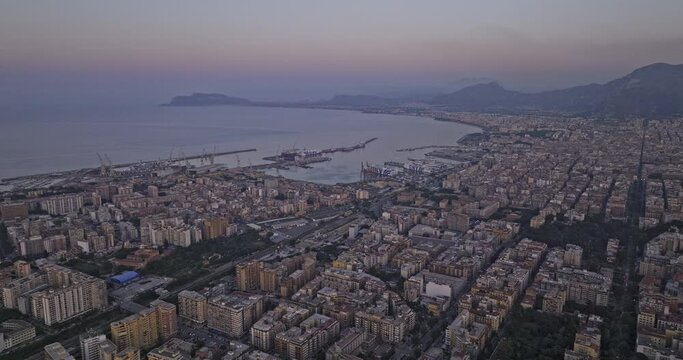 Palermo Italy Aerial v6 cinematic drone fly towards Marina Villa Igiea and Fincantieri shipyard capturing urban cityscape and Tyrrhenian sea views at dusk - Shot with Mavic 3 Cine - May 2023