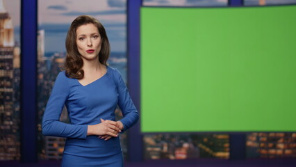 Elegant breaking news reporter showing information green screen studio close up.