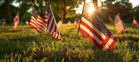 Honoring american veterans on memorial day with flags on graves at a national cemetery