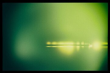 Abstract blurry green background in a black frame and light horizontal lines. - 753568792