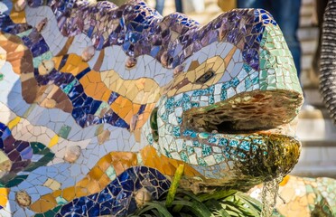 Lizard statue covered in mosaics in the Guell Park in Barcelona, Spain