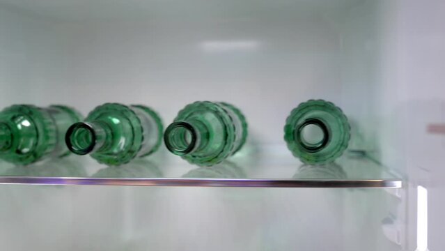 Empty bottles in refrigerator