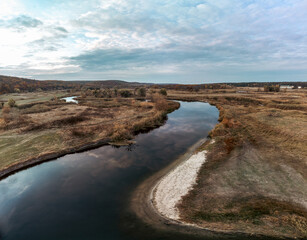 Fototapeta na wymiar Aerial panorama on river curve in autumn valley