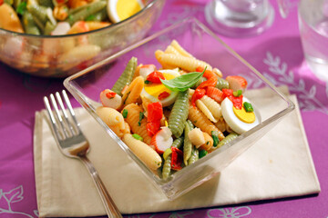 Pasta shells salad with basil.