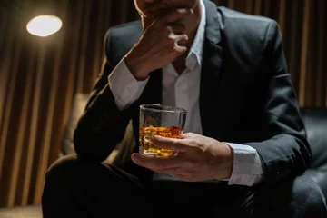 Fotobehang Businessmen in suits drinking  Celebrate whiskey. © aekachai