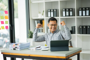 Businessman working at the office Make a happy face