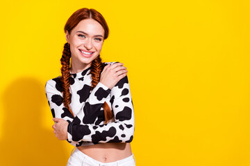 Photo of pretty lovely person toothy smile arms embrace shoulders empty space isolated on yellow color background - obrazy, fototapety, plakaty