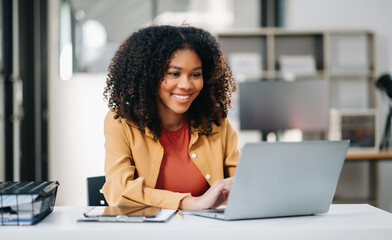 Confident business expert attractive smiling young woman holding digital tablet  on desk .