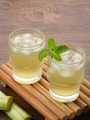 Fresh sugar cane juice (Es Tebu) in glass. Indonesian drink.
