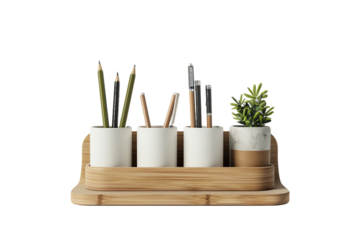 Wooden incense sticks stand upright in a bowl and box, next to colored pencils and a paintbrush