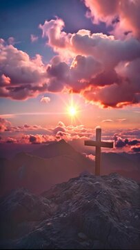 a cross on a mountain in a beautiful shining sky scene rays of light shining into the holy cross of Jesus, death and resurrection of Jesus Christ 4k vertical video