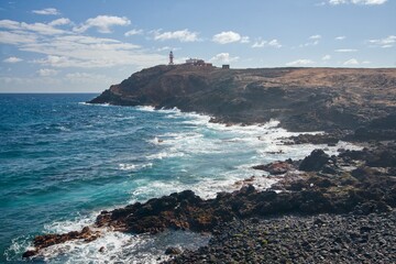 view of the coast of island with lighthouse