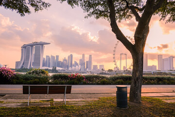 People exercising together in a city park at early evening, Singapore.