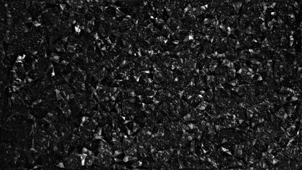 Close-up of black shine asphalt texture with granular surface detail, suitable for background or construction concept, depicting durability and urban infrastructure.