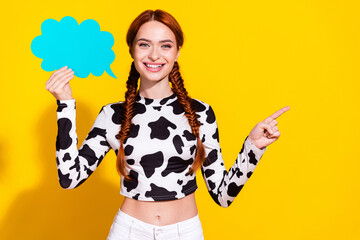 Photo of pretty shiny woman wear cow skin print top rising talking cloud pointing empty space...