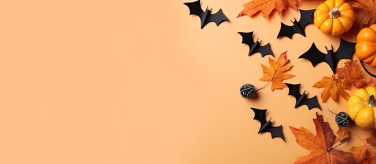 Vibrant Halloween Pumpkins and Bats Set Against a Soft Peach Background