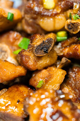 Pork ribs in sweet and sour sauce with cilantro