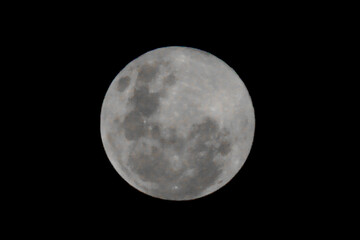 a full moon is bright in the dark night
