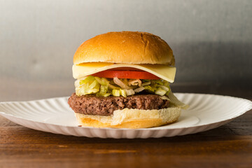 Cheeseburger with lettuce and tomato