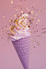 Ice cream in purple cone with gold glitter on pink background. Pastel colors.