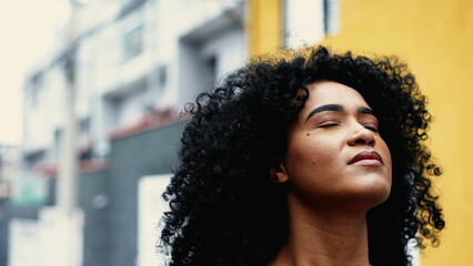 Believing African American Woman Feeling Presence of Higher Power, Inspired Skyward Close-Up Face...