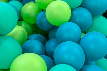 Green blue rubber inflatable balloons close up texture