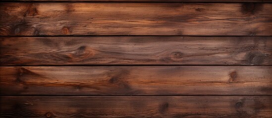 Obraz na płótnie Canvas Texture of a deep brown wooden board