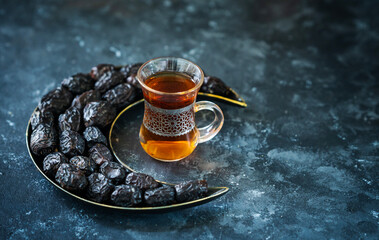 Iftar food concept background, Turkish tea with dates